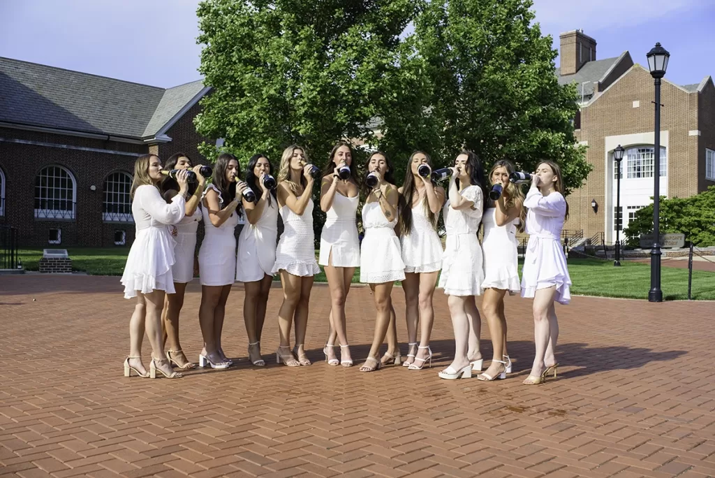 University of Delaware graduation photographer - champagne toast on campus